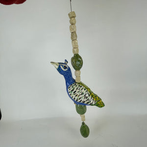 Hanging beaded peacock