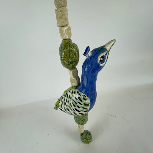 Hanging beaded peacock